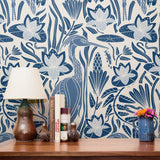 Blue and white decorative pattern with birds, flowers, and foliage in folk art style