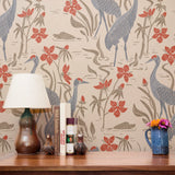 Decorative pattern with blue herons, beige cranes, and red flowers on cream background