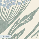 Art Nouveau floral pattern with stylized blue flowers and sage green leaves on cream background