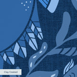 Symmetrical blue folk art design with hands forming heart shape, surrounded by botanical motifs