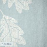 Oak leaves and acorns pattern in white on pale blue-gray background