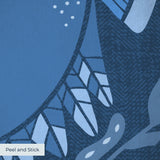 Symmetrical blue folk art design with hands forming heart shape, surrounded by botanical motifs