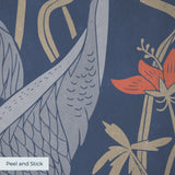 Blue wallpaper pattern with white herons, coral flowers, and green foliage in an Art Nouveau style