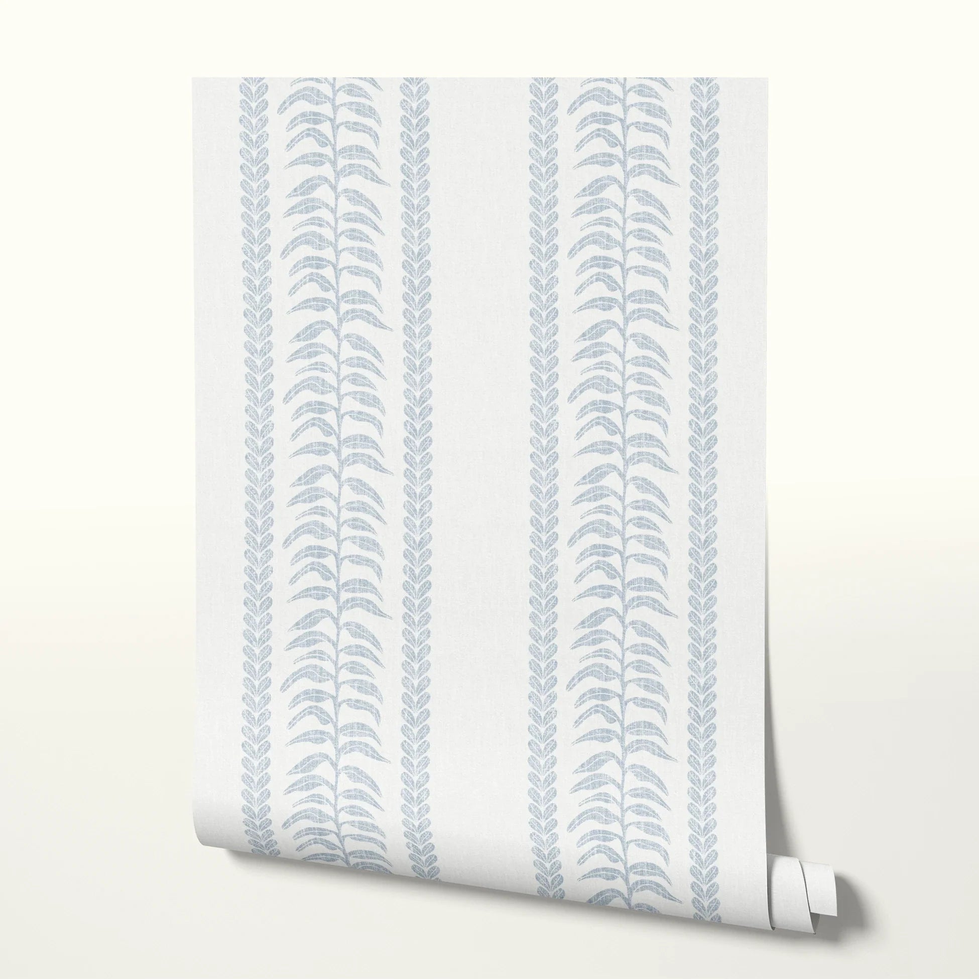 Blue and white botanical stripe pattern with stylized leaf motifs and vertical borders