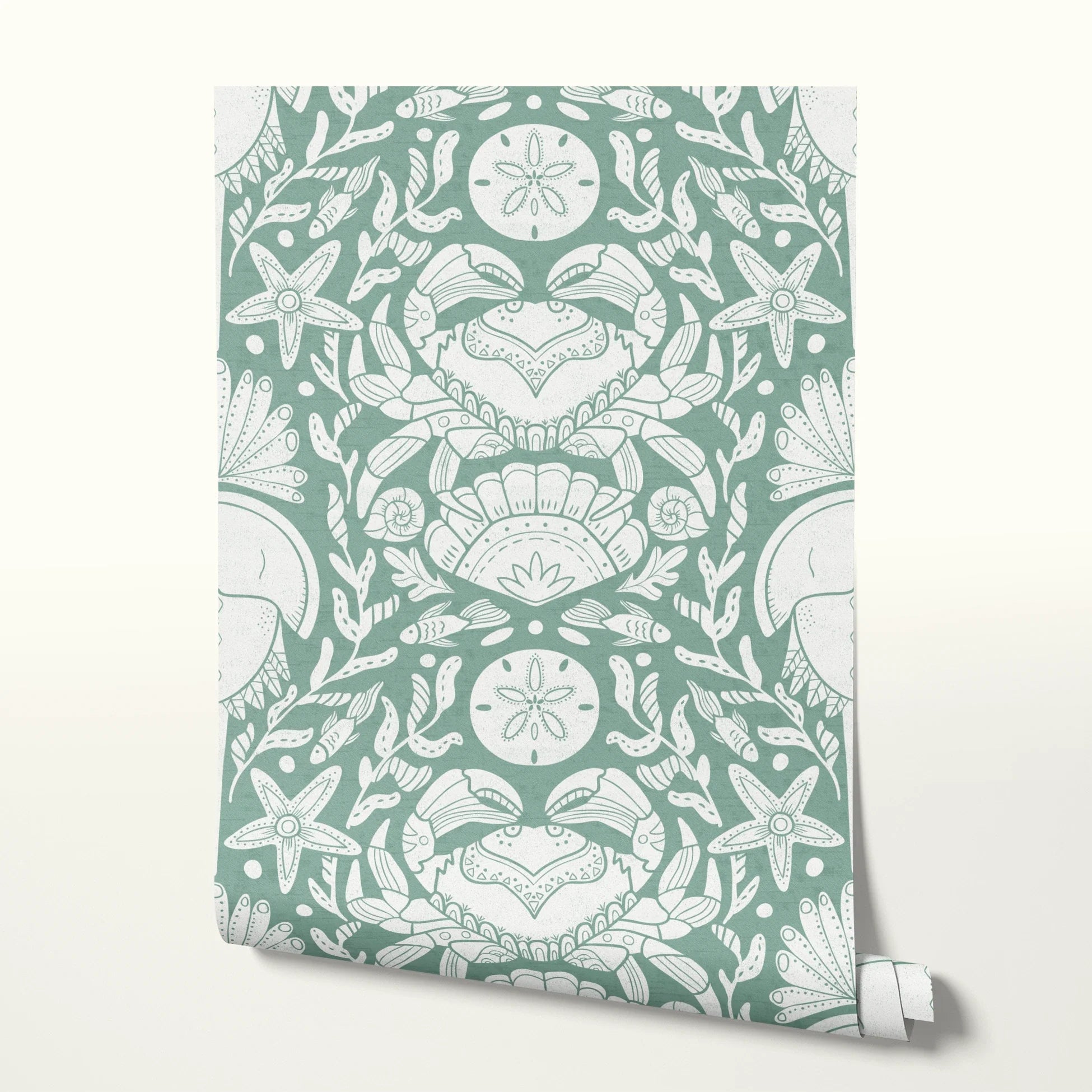 Symmetrical sea-themed pattern in sage green and white featuring crabs, starfish, shells, and marine