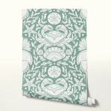 Symmetrical sea-themed pattern in sage green and white featuring crabs, starfish, shells, and marine