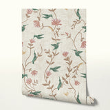Floral pattern with hummingbirds, pink flowers, and tan foliage on cream textured background