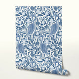 Blue and white decorative pattern with stylized birds, flowers, and botanical motifs in a folk art s