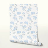 Delicate blue floral pattern with stems and leaves on white background