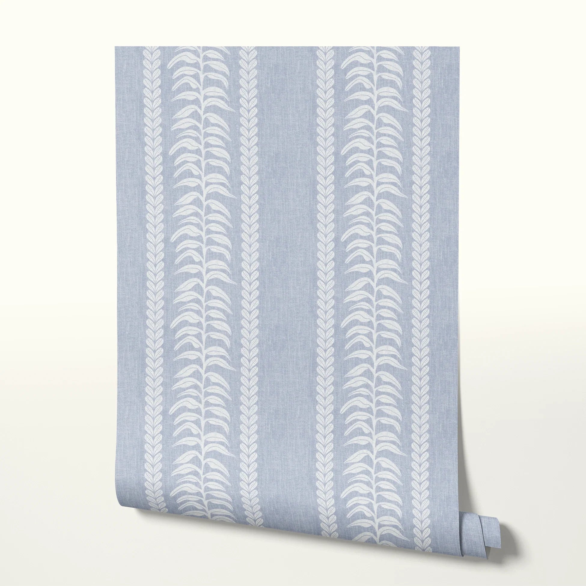 Blue and white vertical stripe pattern with leaf motifs and textured linen background