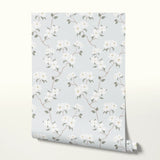 Delicate floral pattern with gray-green leaves and white flowers on light gray background