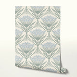 Art Nouveau floral pattern with stylized blue flowers and sage green leaves on cream background