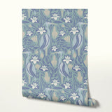 Art Nouveau floral pattern with white lilies, blue-green leaves and decorative pods on blue backgrou