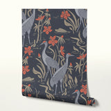 Herons and cranes among reeds and red flowers on dark blue background in decorative pattern