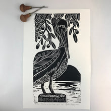Load image into Gallery viewer, Brown Pelican and Live Oaks, limited edition black and white block print. Hand pulled on 12x18 paper
