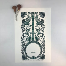 Load image into Gallery viewer, Banjo and Frog,  Hand pulled block print in dark green with 13x19 mat
