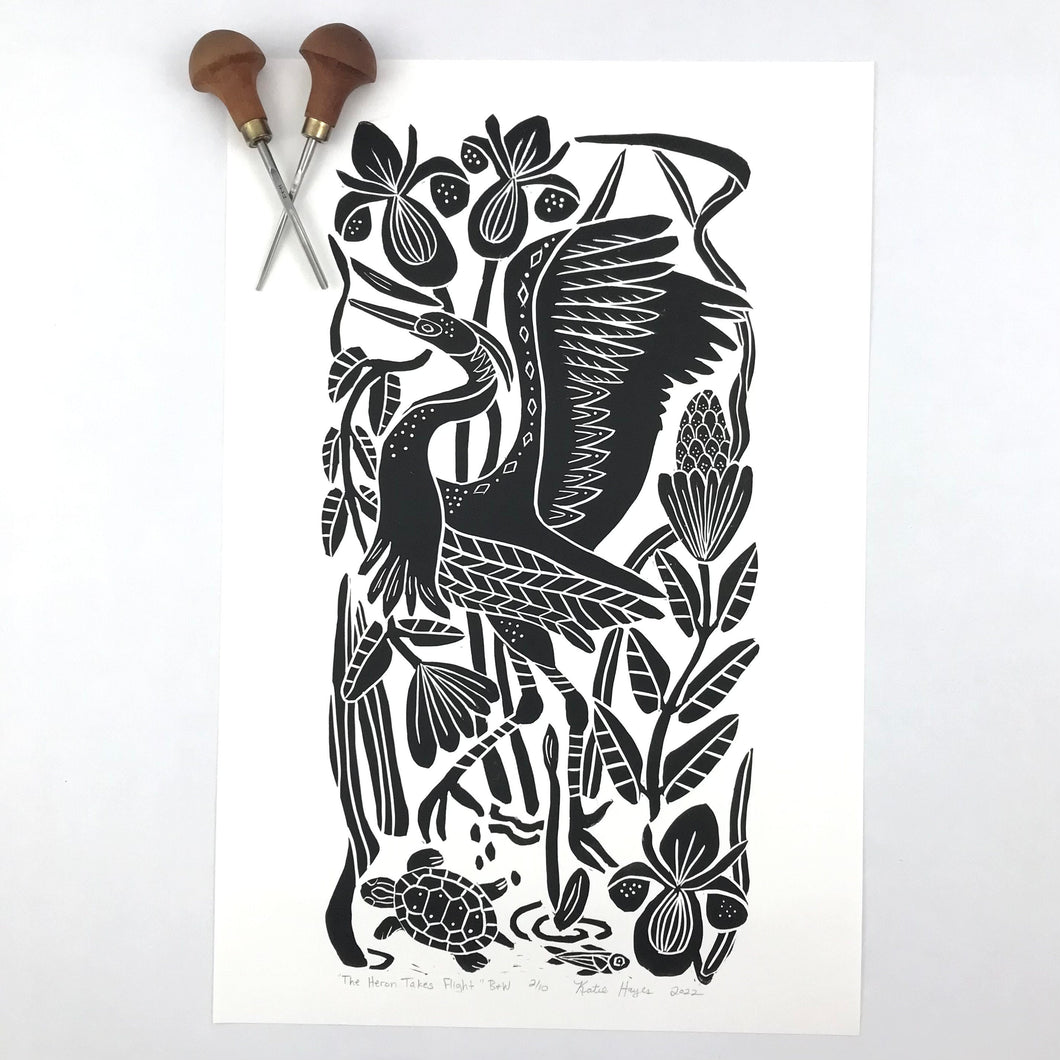 The Heron Takes Flight hand pressed block print. Black and White with 13x19 mat